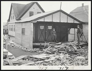 One Wall Intact, the garage of Dr. William J. Harkins, in the Gun Rock section of Hull, caught the full force of the tide and storm. Note complete window casing is wreckage at right.