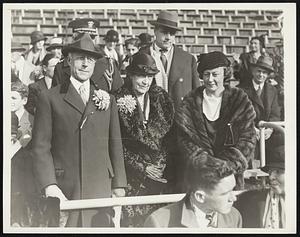 Secretary of the Navy at Navy-Army Game. Secretary of the Navy Charles Francis Adams, Mrs. Adams and Their Daughter, Mrs. H.S. Morgan, in Their Box at Franklin Field, Philadelphia for the Army-Navy Game.