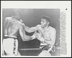 Challenger's Only Solid Punch--Floyd Patterson got off this right hand shot to Heavyweight Champion Sonny Liston's chin before being knockout by defending champion Liston. It was Patterson's only solid punch of the fight. Patterson was out in 2 minutes 10 seconds of the first at Las Vegas tonight.