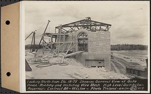 Contract No. 80, High Level Distribution Reservoir, Weston, looking north from Sta. 19+75 showing general view of gatehouse, riveting and installing wire mesh, high level distribution reservoir, Weston, Mass., Jun. 21, 1940