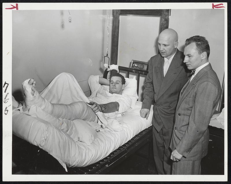 Get Up Out Of There, You Big Heel was the wisecrack greeting of Johnny Crawford (left) and Kenny Smith when they visited Ed Sandford today at Somerville Hospital. But the Bruins' center won't be back in action for a long time following an operation this morning for repair of a severed Achilles tendon.