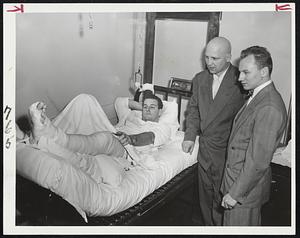 Get Up Out Of There, You Big Heel was the wisecrack greeting of Johnny Crawford (left) and Kenny Smith when they visited Ed Sandford today at Somerville Hospital. But the Bruins' center won't be back in action for a long time following an operation this morning for repair of a severed Achilles tendon.