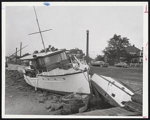 Beached Boats-This is a section of the beach between L. St., South Boston, and the South Boston Yacht Club, where boats were driven by winds of Hurricane Carol.
