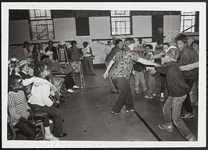 Young people dancing at a special event at Cambridge Community Art Center