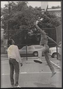 Donovan Thomas and Omo Moses playing basketball