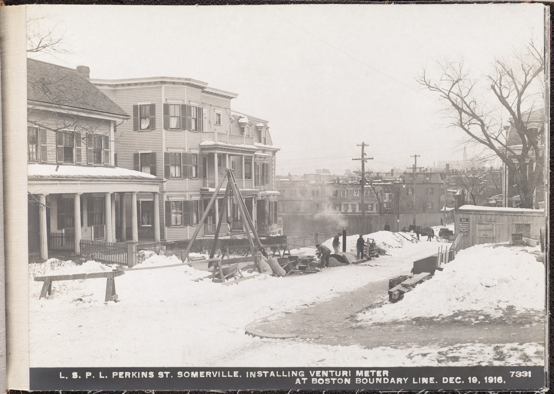Distribution Department, Low Service Pipe Lines, installing Venturi meter in Perkins Street, at Boston boundary line, Somerville, Mass., Dec. 19, 1916