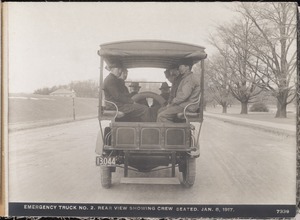 Distribution Department, Emergency Truck No. 2, rear view showing crew seated; at Chestnut Hill Reservoir, Brighton, Mass., Jan. 8, 1917