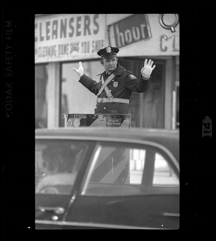 Policeman directs traffic, Somerville, MA