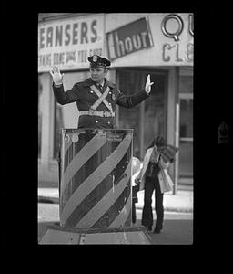 Policeman directs traffic, Somerville, MA