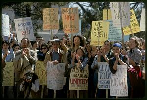 Boston University employee strikers with demand signs, Boston