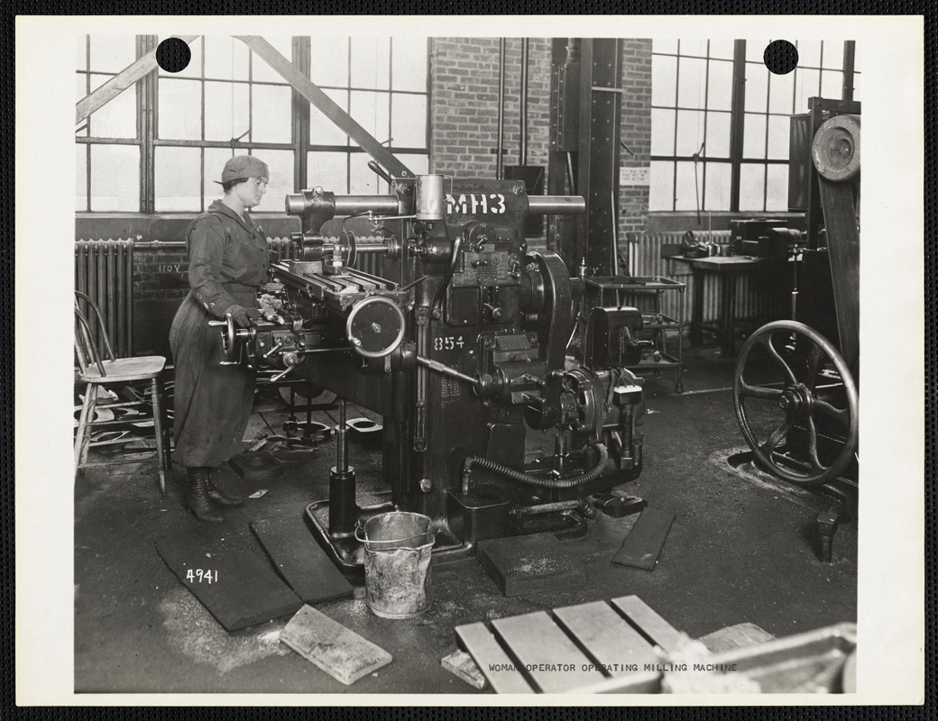 Woman operator operating milling machine