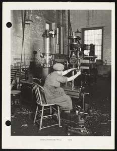 Woman operating drill