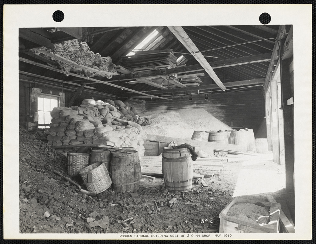 Wooden storage building west of 240 MM shop