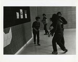 Students clowning in a school hallway