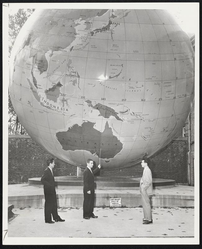 On Tour - Nobuo Yokota (left) and Sachito Sasaki of Tokyo, Japan, look on as Leonard Smith of Malden, President of the Babson Institute Student Council (center) points out their homeland on the Babson World Globe. Both travelers are presently touring American Colleges under the auspices of the National Student Association.