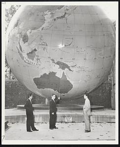 On Tour - Nobuo Yokota (left) and Sachito Sasaki of Tokyo, Japan, look on as Leonard Smith of Malden, President of the Babson Institute Student Council (center) points out their homeland on the Babson World Globe. Both travelers are presently touring American Colleges under the auspices of the National Student Association.