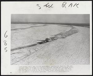 Ice Gorge Slows Mississippi Traffic- The ice breaker Harry S. Truman is cutting a channel through an ice gorge which has allowed river traffic on the Mississippi during the past few days. The ice jam according to the U.S. Coast Guard extends from this city for a distance of 60 miles upstream.
