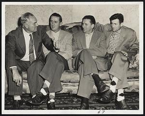 Here's How we Did It in the old days," demonstrates Coach Heine Manush, ex-outfield great, to a trio of Washington Senators in a farming bee at the Kenmore lobby after today's game at Fenway Park with the Red Sox rained out. Left to right, are: Manush, John Schmitz, Frank Shea and Mickey Vernon.