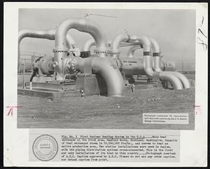 Fig. No. 1 First Nuclear Heating System in the U.S.A... Main heat exchanger at the 100-K Area, Hanford Works, Richland, Washington. Capacity of heat exchanger shown is 500,000,000 Btu/hr., and serves to heat an entire production area. Two similar installations were used in duplex, with piping distribution systems cross-connected. This is the first and only installation of its kind in this country ... Photograph courtesy of A.E.C. Caption approved by A.E.C. Please do not use any other caption, nor detach caption from print.