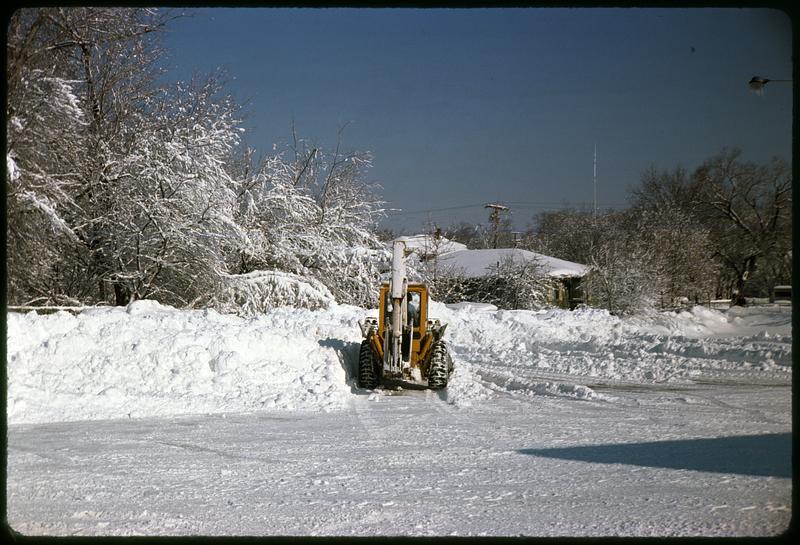 Pile of snow, snow plow in center