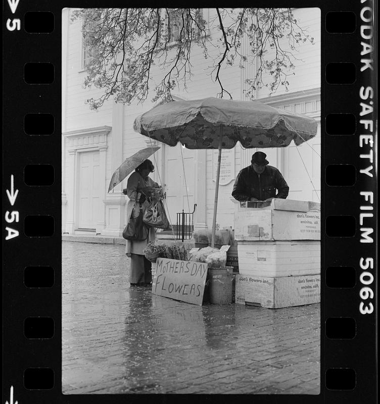 Pleasant Street flower man in rain