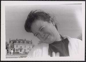 A woman squinting