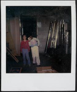 Two girls being silly in the basement