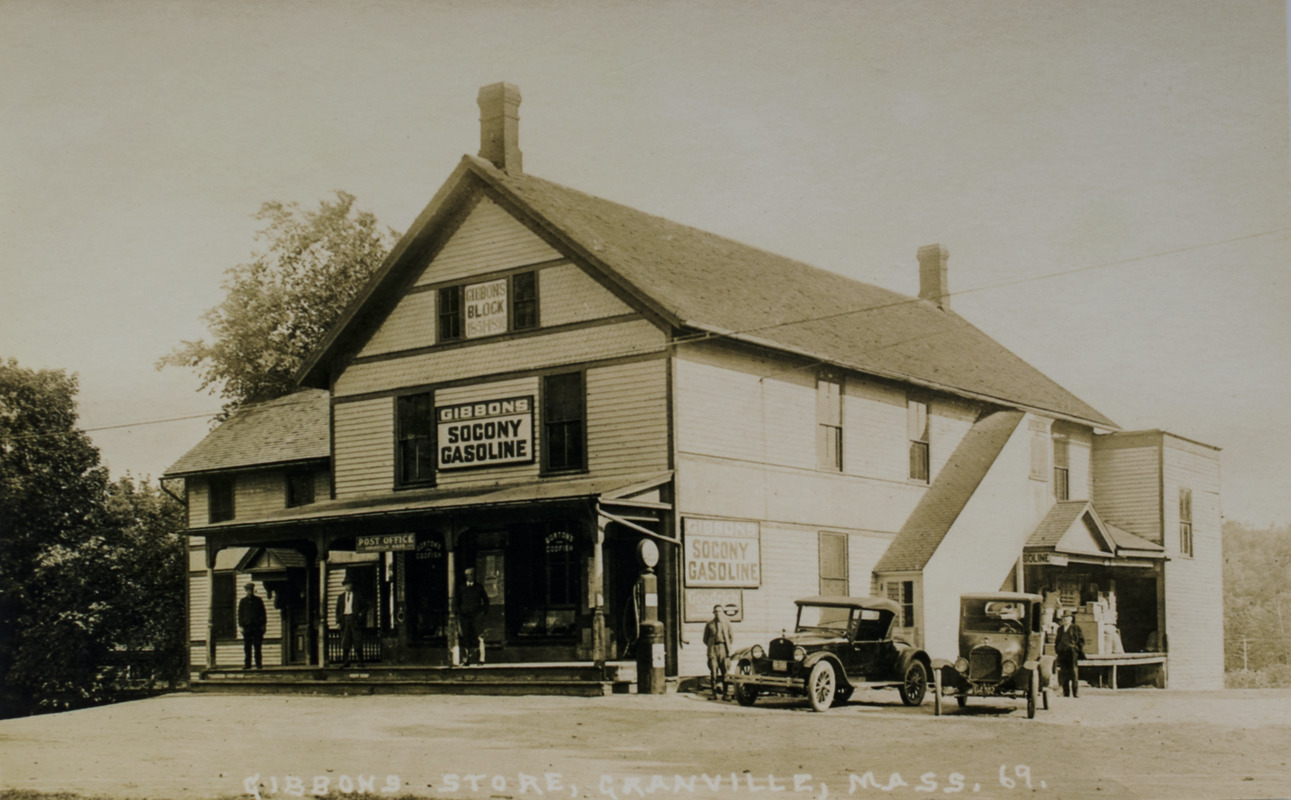 Gibbons store with car and truck out front