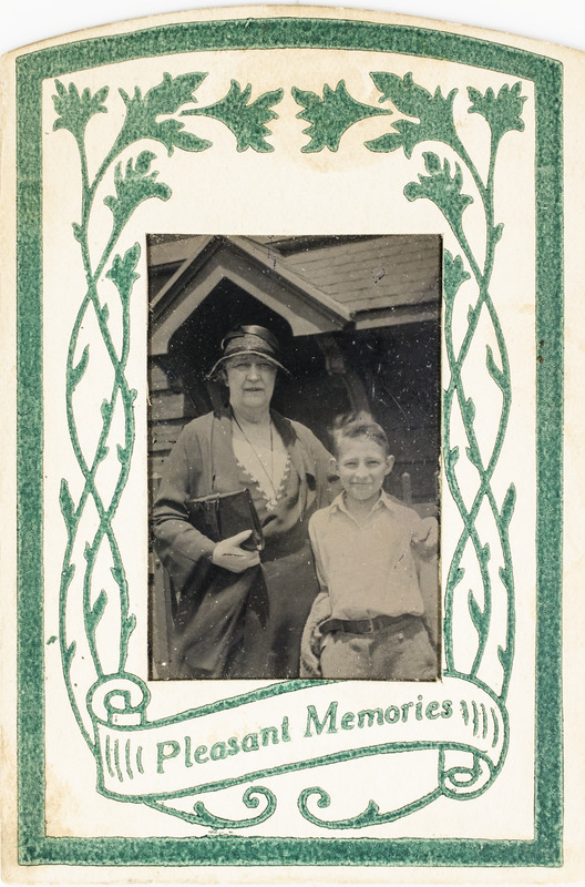 Unidentified woman and boy with "Pleasant Memories" frame, 120