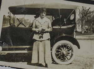 Unidentified woman with car, 099