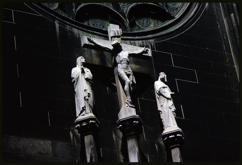 Crucifixion statue with accompanying figures