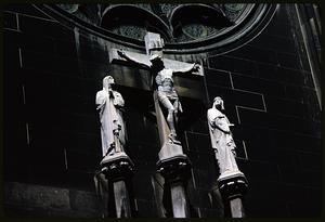 Crucifixion statue with accompanying figures