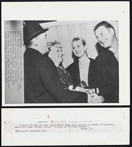 No Smiles Now -- Mr. and Mrs. George Caldough of Vancouver, left, welcomed a grinning Errol Flynn and protege Beverley Aadland, 17, to the west coast city Oct. 9. Wednesday Flynn died. Miss Aadland had to be put under sedation.