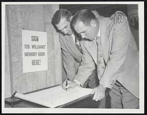 Signing Up, Outfielder Pat Mullin (left) and Pitcher Virgil Trucks of the Detroit Tigers put their names on one of the Herald-Traveler Ted Williams Memory Books at the Hotel Kenmore yesterday after their meeting with the Sox had been called off.