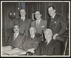 Annual Broadcast of the Massachusetts Committee is being planned by this group, meeting in the office of Charles Francis Adams, seated, center, general chairman of the committee. Others are (left, seated) Abraham E. Pinanski, and (right, seated) Oscar W. Haussermann, executive committee members. Standing, left to right, Michael T. Kelleher, executive committee member, Ben G. Shapiro, committee secretary, and Ralph M. Eastman, committee treasurer.