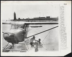 Chicago – Air-Conditioned Fishing – With the temperature at 98 degrees here today, cool comfort whale they fished off the Lake Michigan shore was found by David Kepple (left, on pontoon) of Gary, Ind., and Dirk Van Dam of Walden, N.Y. They kept the engine running on their light float plane to propel the cool lake air past them while they tried luck at fishing.