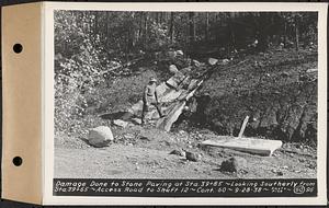 Contract No. 60, Access Roads to Shaft 12, Quabbin Aqueduct, Hardwick and Greenwich, damage done to stone paving at Sta. 39+85, looking southerly from Sta. 39+65, Greenwich and Hardwick, Mass., Sep. 28, 1938