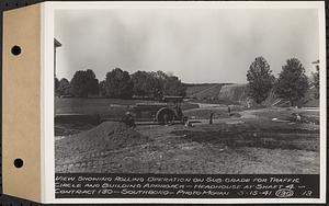 Contract No. 130, Grading, Loaming, and Grassing Vicinity of Shaft 4, Pressure Aqueduct, Southborough, and Improvement of Access Roads to the Intake Works and at Norumbega Reservoir, Marlborough, Southborough, Weston, view showing rolling operation on sub grade for traffic circle and building approach, headhouse at Shaft 4, Southborough, Mass., May 15, 1941