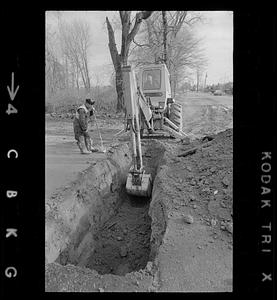 Excavator digging a hole