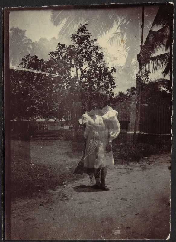 Double exposure of woman in white dress; man with arms crossed; tropical locale