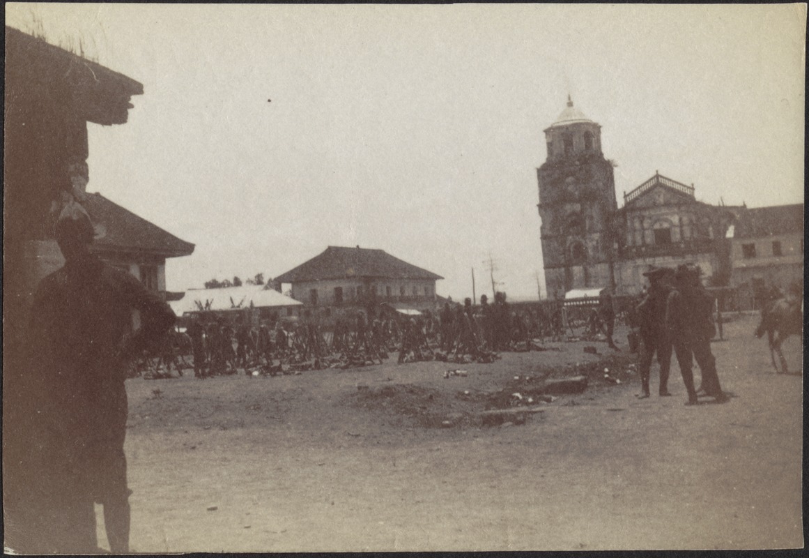 Military activity in a city square near church