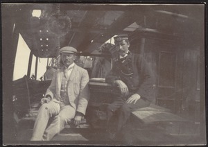 John Gardner Coolidge and ship officer smoking on deck of ship
