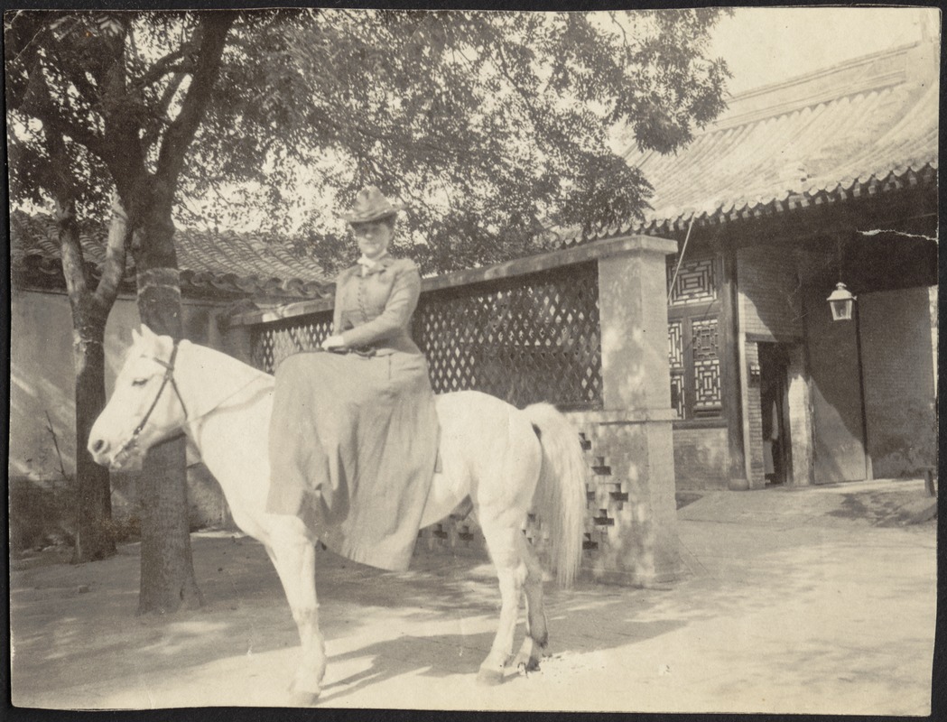 Laura Conger Buchan on white pony, U. S. Legation, Peking