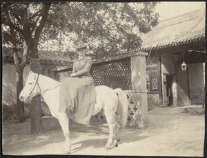 Laura Conger Buchan on white pony, U. S. Legation, Peking