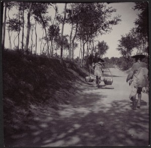 Villagers walking down road