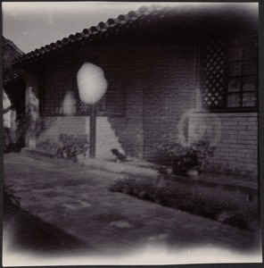 House in Peking, China — 2 blurry photos of courtyard outside bedroom