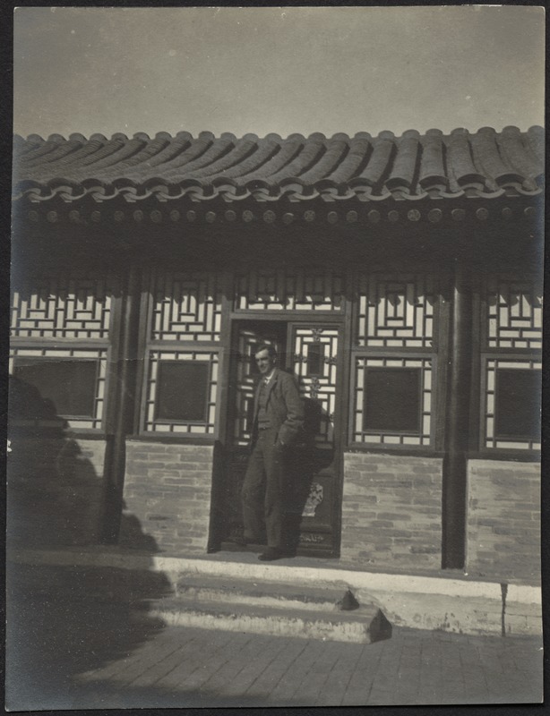House in Peking, China — Unidentified man standing in doorway, possibly guest quarters.