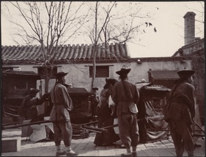 Chinese woman appearing to board a carriage or rickshaw; five men in attendance