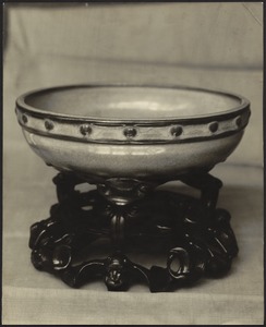 Small Chinese ceramic bowl with carved wooden stand