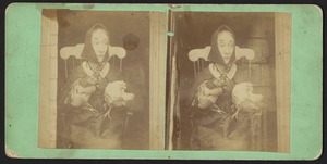Portrait of Nancy Luce, seated, holding two chickens